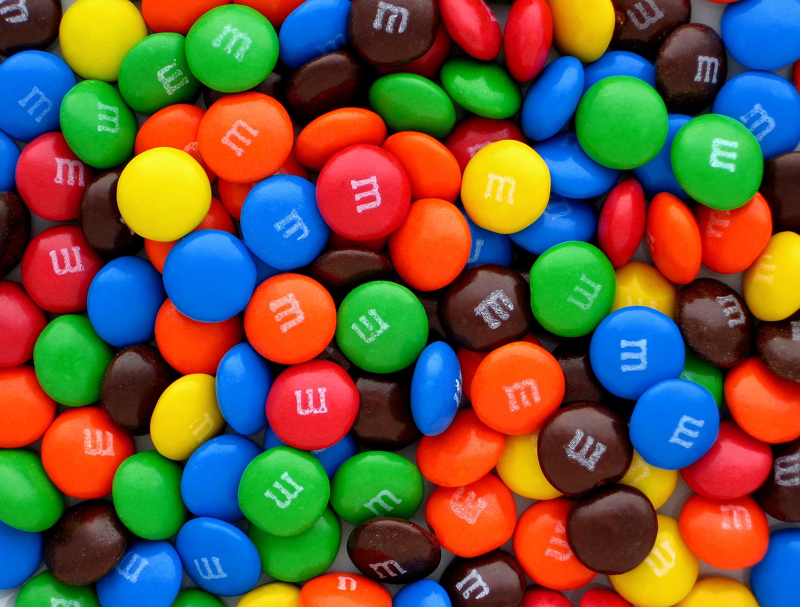 M&M Candies, Photo by [Evan Amos](https://commons.wikimedia.org/wiki/File:Plain-M&Ms-Pile.jpg)